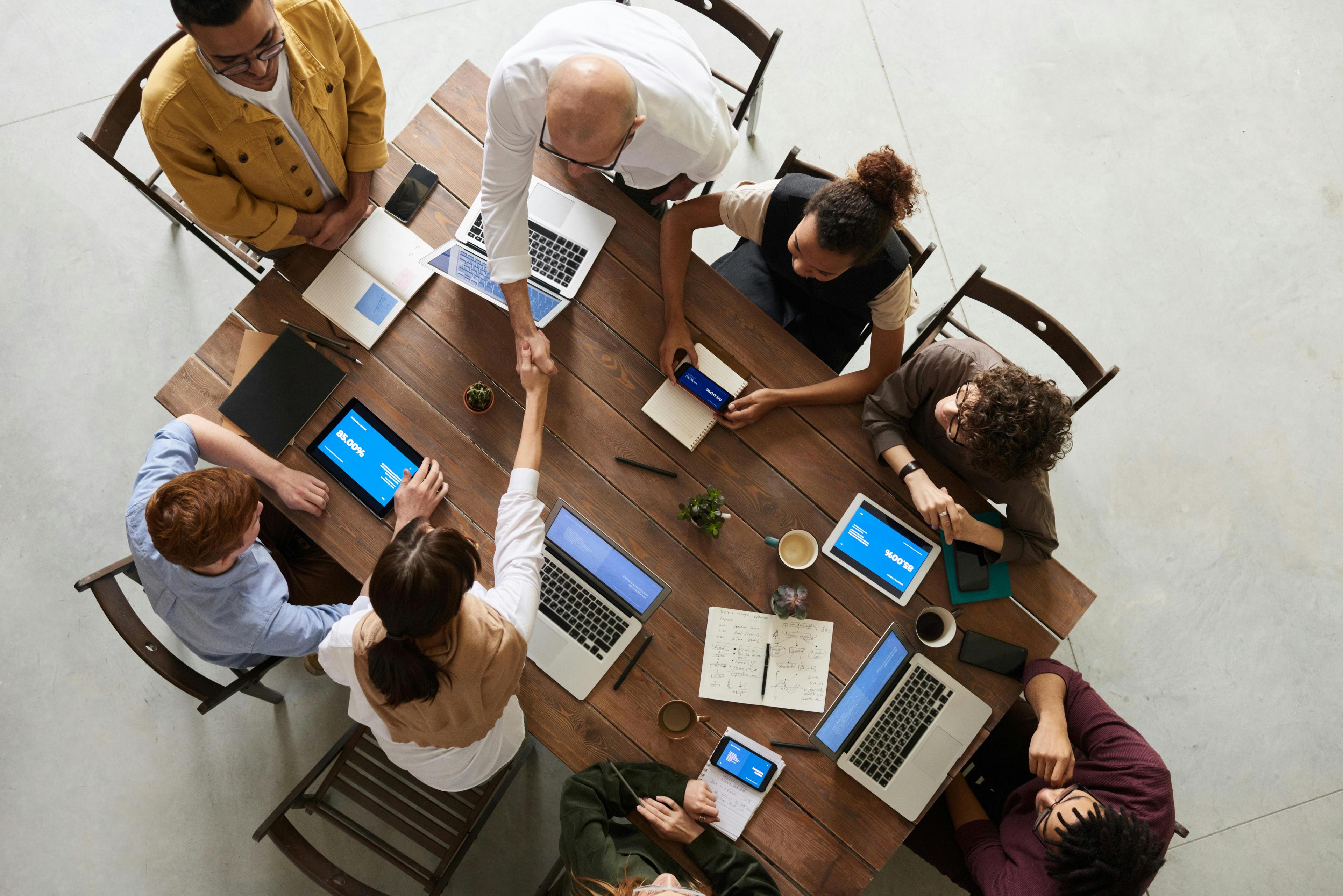 An empty boardroom with a rising revenue chart overlay